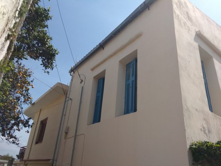 Stone house for sale in Chania blue shutters