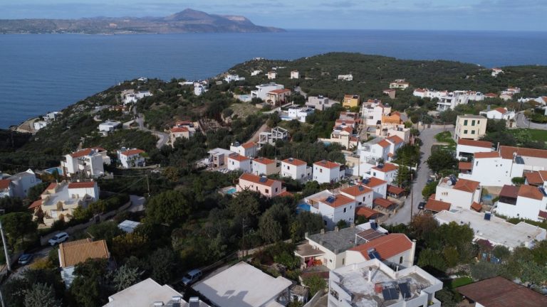 Bird’s-eye perspective of Plaka off-plan development with surrounding area and scenic views