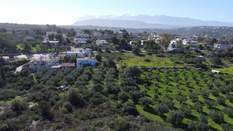 Drone Photo of the Plot with Mountains in the Background