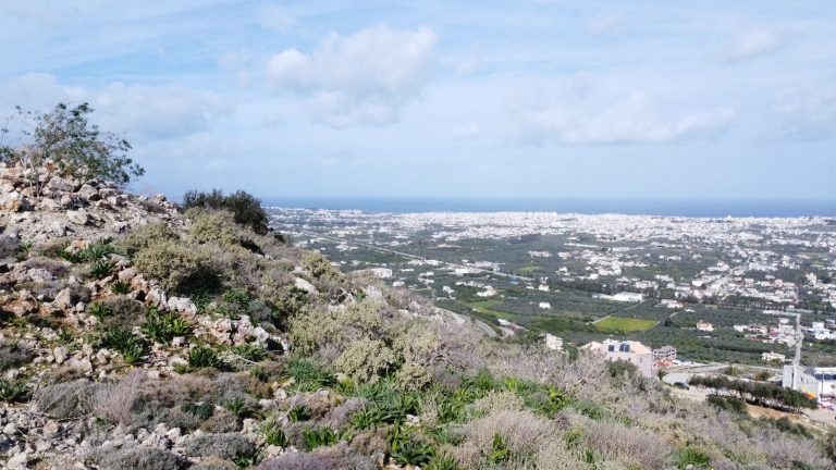 Ground-level view of sea and Chania city from land plot in Malaxa, Crete