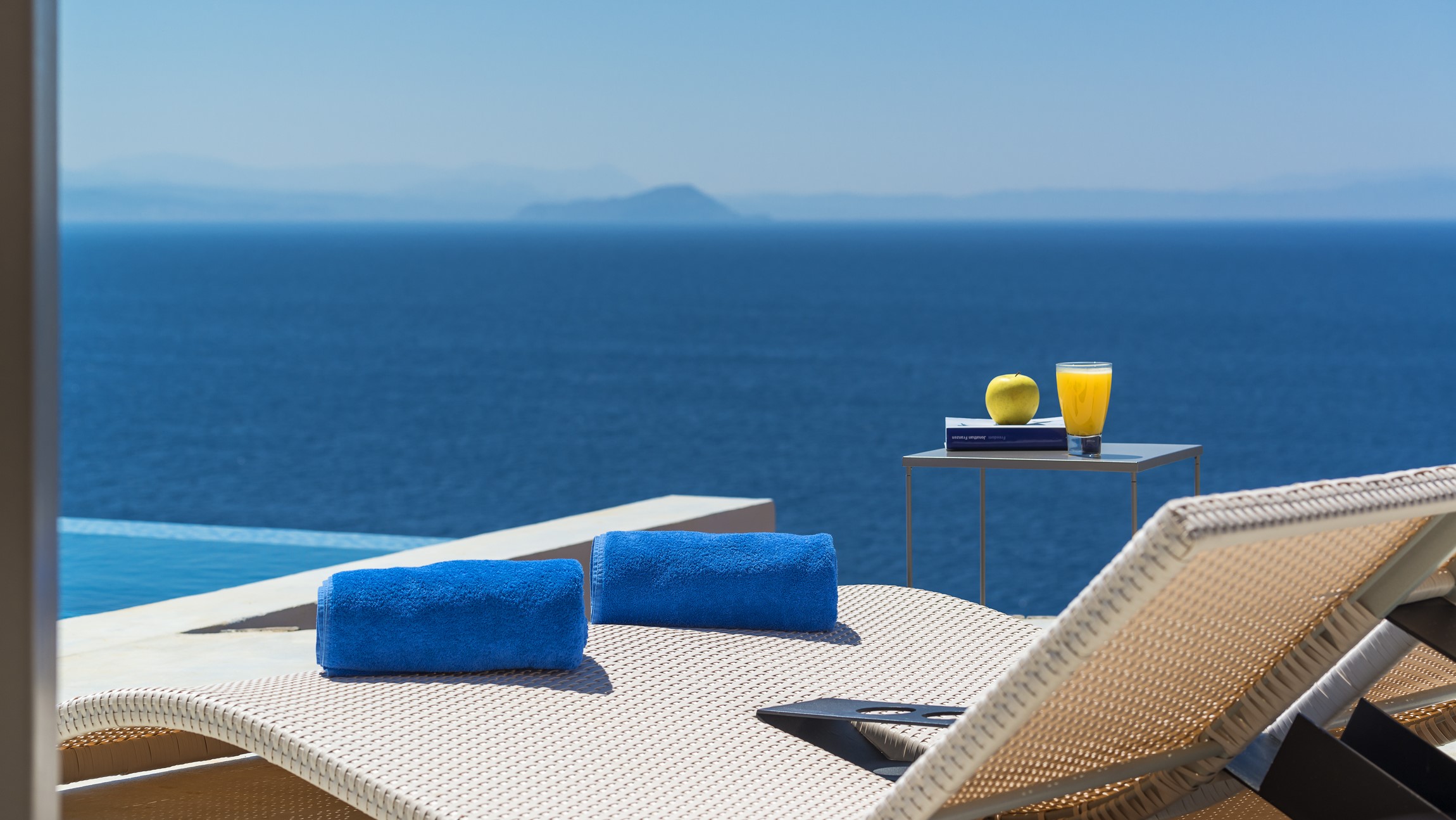 Luxury villa providing concierge services by a swimming pool in Crete