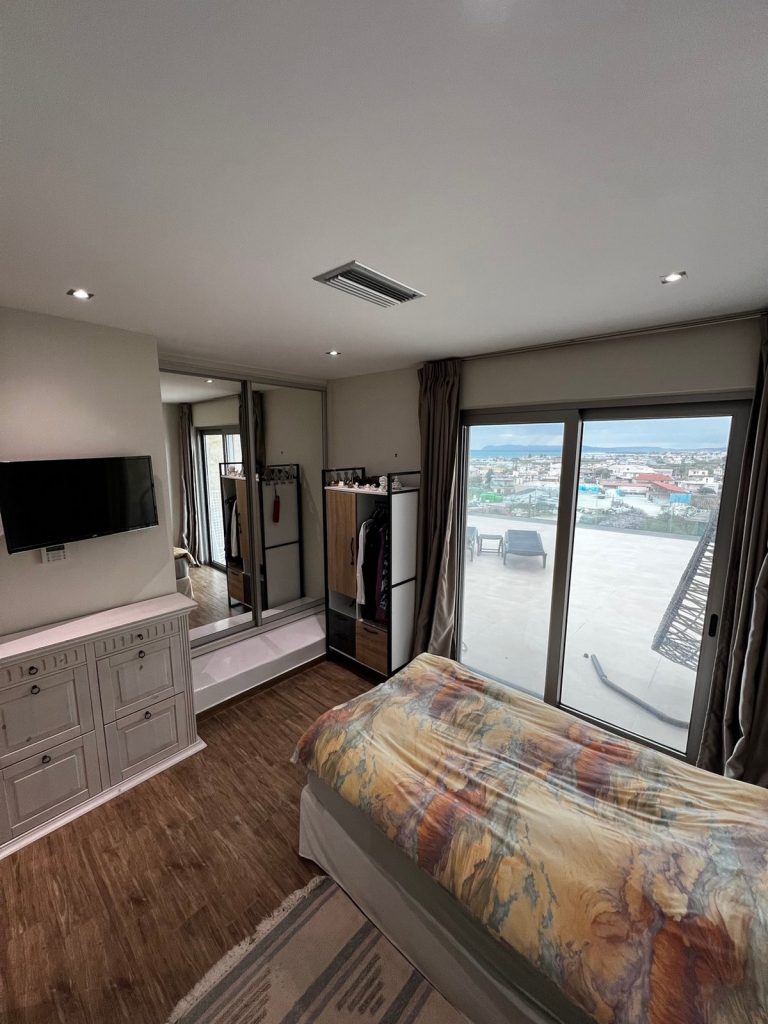 master bedroom in villa on crete with stunning village and sea views