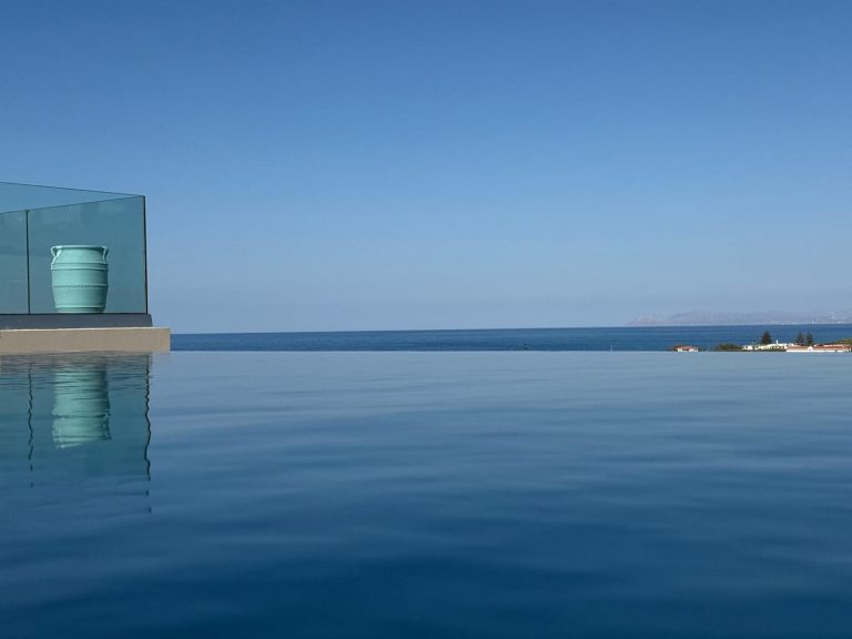 photo of infinity pool aligning perfectly with the sky horizon on villa for sale in chania