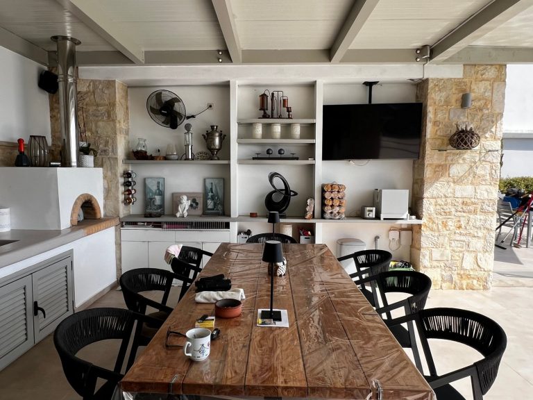 outdoor covered dining area with stone BBQ in kolymbari