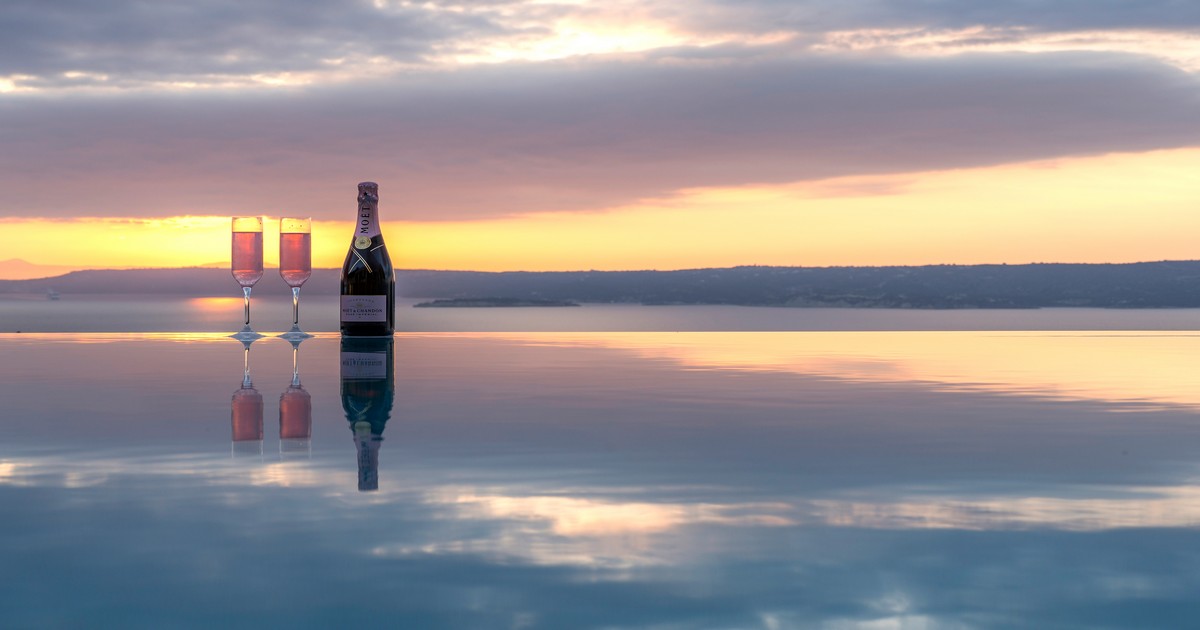 Luxury villa swimming pool overlooking the sea and sunset in Crete – guide to buying property in Crete Greece