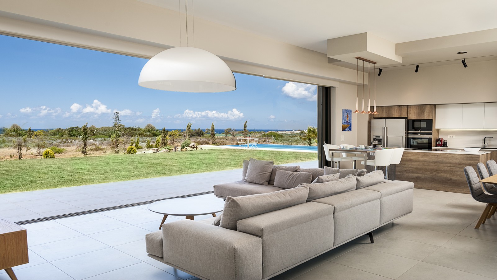 Open-plan living room in a luxury Crete villa with panoramic sea views