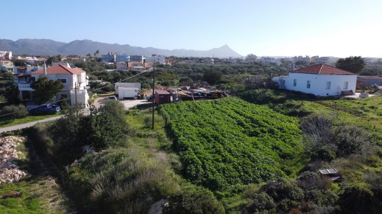 Aerial perspective of Chorafakia plot in Akrotiri with scenic sea and mountain views