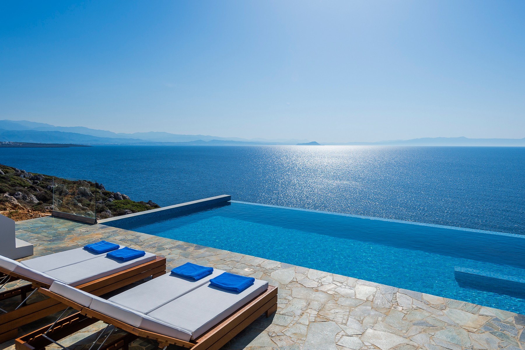 Infinity pool overlooking the sea at a luxury villa under professional management in Chania