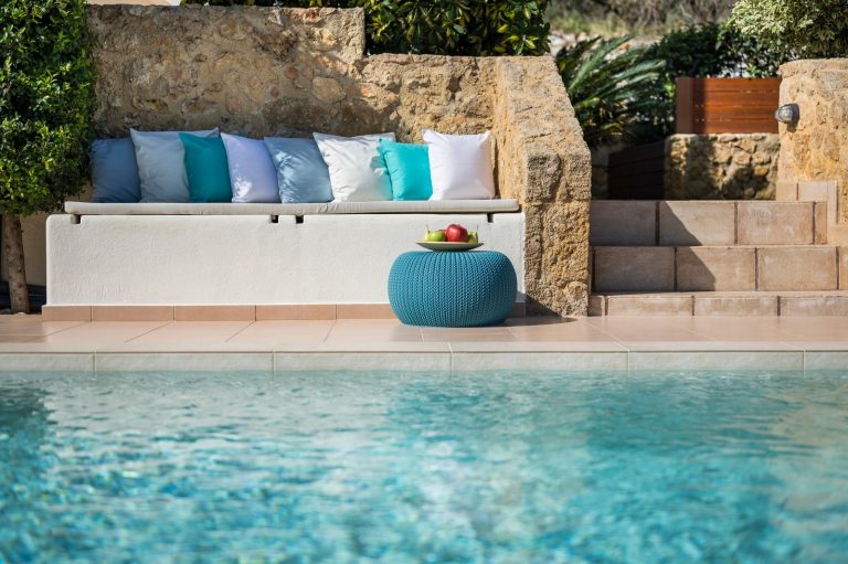 Private swimming pool and outdoor living area in luxurious property in Afrata