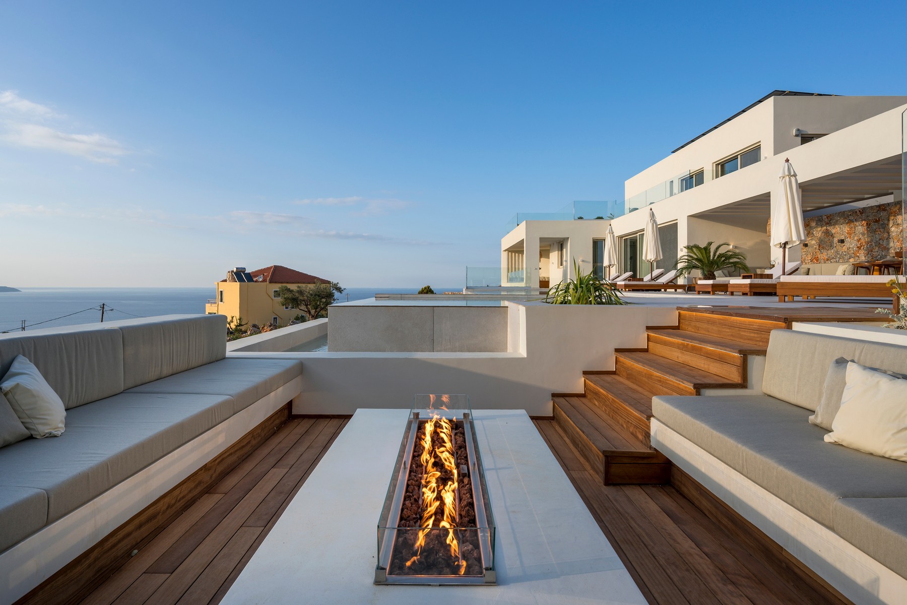 Outdoor terrace and landscaped area maintained by villa management services in Chania