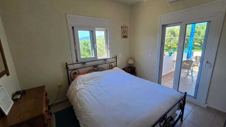 Double bedroom with balcony doors and views