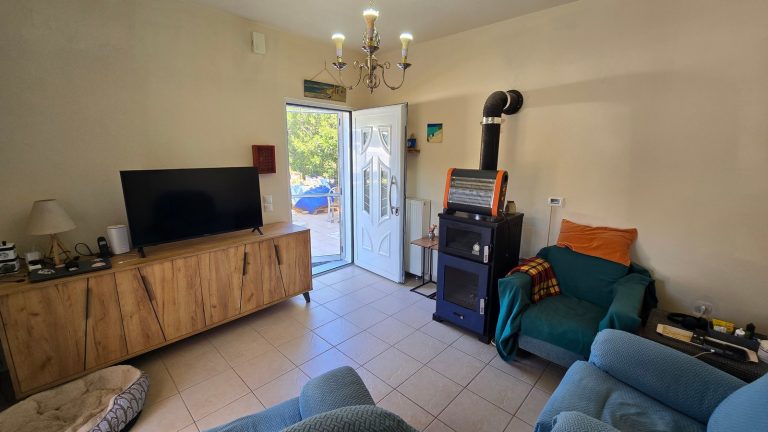 Bright living room area with wood stove burner