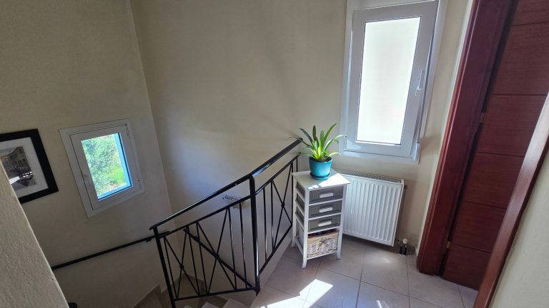 Staircase leading to the upper floor of the maisonette for sale