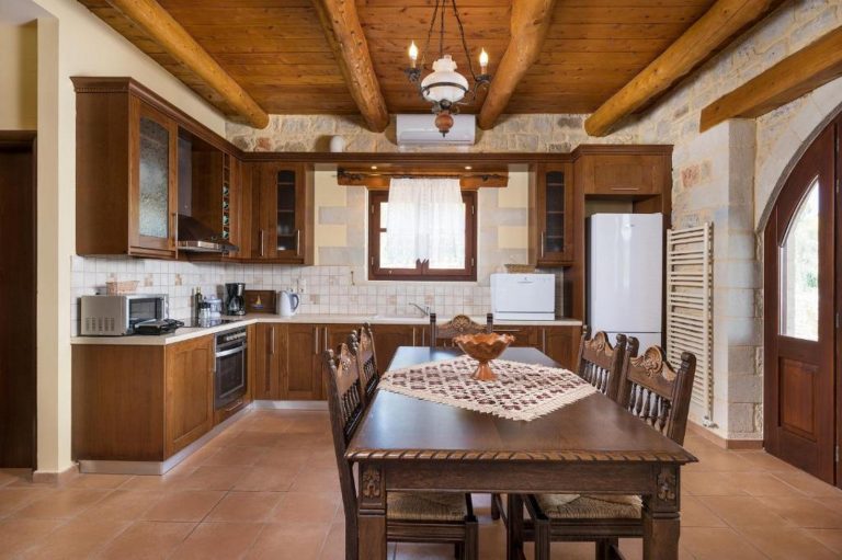 Contemporary kitchen in stone house near Falassarna with dining area and appliances
