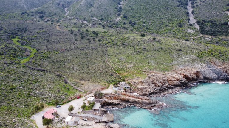 Bird’s-Eye View of a Scenic Crete Plot Overlooking Crystal Waters