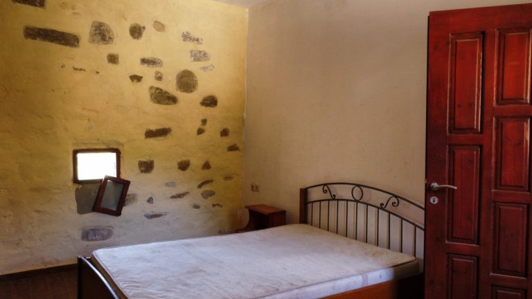 traditional bedroom in stone house for sale in chania crete