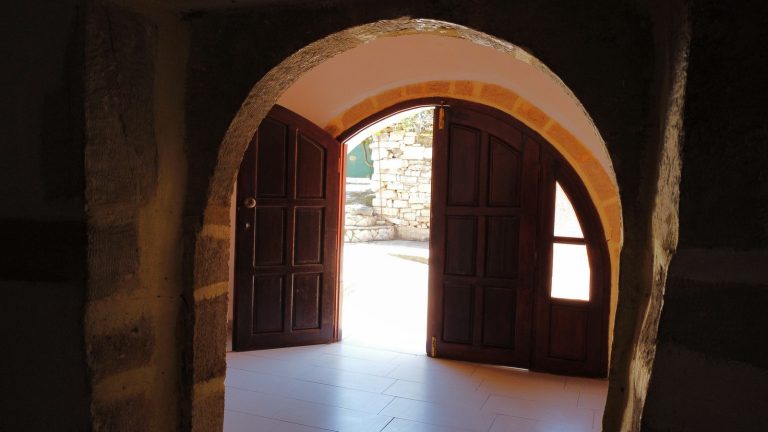 large arched stone door in traditional property for sale in crete