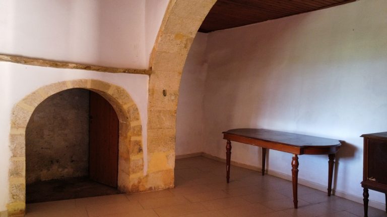 Interior Spaces with Beautiful Arches Dividing Rooms in Traditional Home for Sale