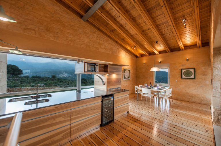 Cozy Wooden Kitchen with Windows Framing Views of the Countryside